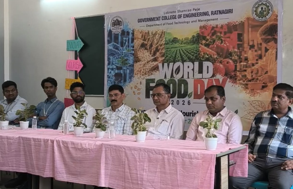 Principal and faculty members seated at the dais with the World Food Day 2026 banner at LSPGCOER Ratnagiri